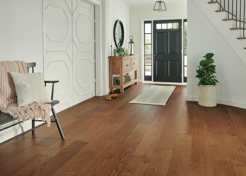 Home entryway with medium toned hardwood floors